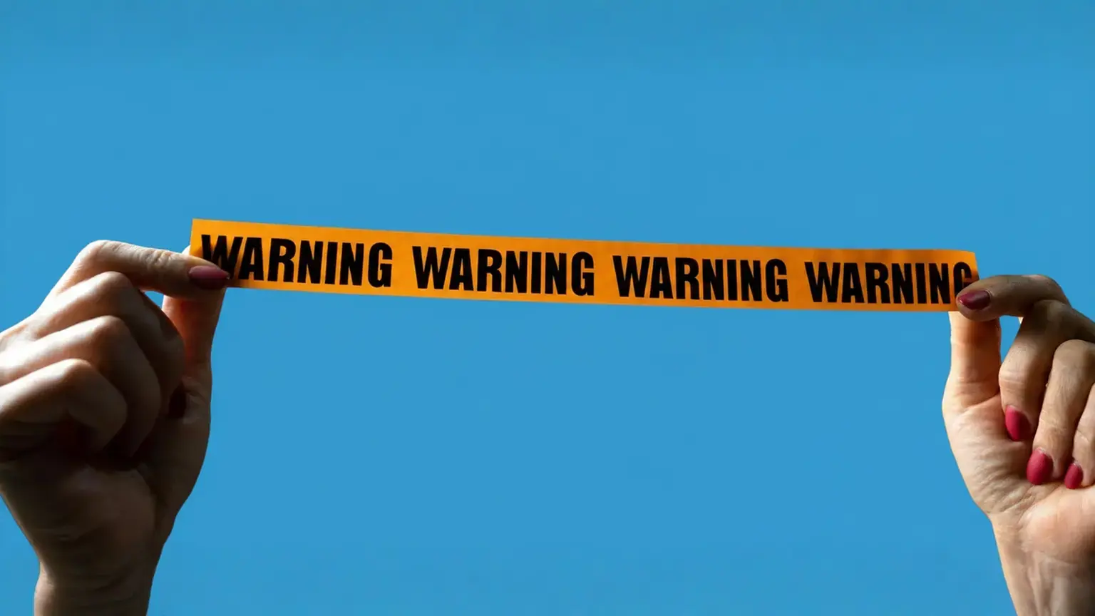 Hands holding up an orange strip with 